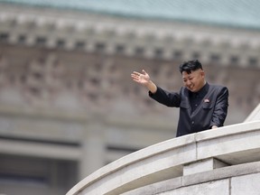 North Korean leader Kim Jong-un waves to the people during a parade to commemorate the 60th anniversary of the signing of a truce in the 1950-1953 Korean War, at Kim Il-sung Square in Pyongyang in this July 27, 2013 file photo. North Korea said it had successfully conducted a test of a miniaturised hydrogen nuclear device on the morning of January 6, 2016, marking a significant advance in the isolated state's strike capabilities and raising alarm bells in Japan and South Korea.    REUTERS/Jason Lee/Files