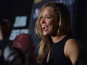 Ronda Rousey talks to the press before a face-off for the UFC fight in Melbourne on Nov. 13, 2015. (AFP PHOTO/Paul CROCK)