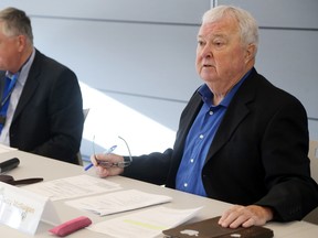 Luke Hendry/The Intelligencer
Chairman Terry McGuigan, right, speaks during a meeting of the Hastings and Prince Edward Counties Board of Health in Belleville, Board members and staff, including Dr. Richard Schabas, left, say Ontario's recent change in public health funding is unfair to smaller centres.
