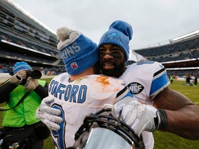 Detroit Lions quarterback Matthew Stafford (9) hugs wide receiver Calvin Johnson (81) after an NFL football game against the Chicago Bears, Sunday, Jan. 3, 2016, in Chicago. The Lions won 24-20. (AP Photo/Charles Rex Arbogast)