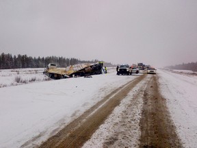 Emergency crews remain on scene at a multi-vehicle collision on Highway 63 near Mariana Lake. Photo Supplied/RCMP