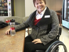 Elizabeth Woudsma, a peer support co-ordinator for Spinal Cord Injury Ontario, takes a break in the cafeteria of St. Mary's of the Lake Hospital in Kingston. (Michael Lea/The Whig-Standard)