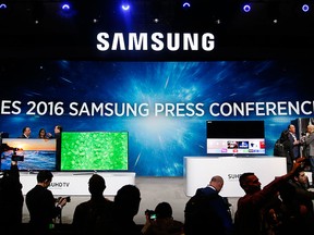 People line up to take pictures of new items during a Samsung news conference at CES Press Day at CES International, Tuesday, Jan. 5, 2016, in Las Vegas. (AP Photo/John Locher)