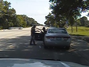In this July 10, 2015, file frame taken from dashcam video provided by the Texas Department of Public Safety, Texas State Trooper Brian Encinia confronts Sandra Bland after a minor traffic infraction in Waller County,Texas. (Texas Department of Public Safety via AP, File)