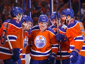 Lauri Korpikoski, centre, celebrating a goal against St. Louis in October, says he also celebrated after Finland defeated Russia in the gold medal game of the World Junior in Helsinki on Tuesday. (Ian Kucerk, Edmonton Sun)