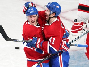 Canadiens' Torrey Mitchell (17) celebrates with teammate Paul Byron (41) after scoring a short-handed goal against the Devils during second period NHL action in Montreal on Wednesday, Jan. 6, 2016. (Jean-Yves Ahern/USA TODAY Sports)