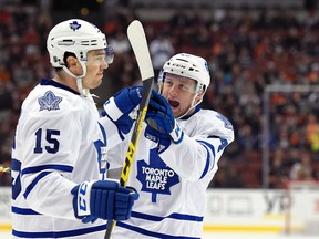 Maple Leafs right wing P.A. Parenteau (left) celebrates his first of two goals with teammate Morgan Rielly during first period NHL action against the Ducks in Anaheim on Wednesday, Jan. 6, 2016. (AP Photo/Mark J. Terrill)