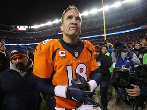 Denver Broncos quarterback Peyton Manning (18) as he walks off the field after the game against the San Diego Chargers at Sports Authority Field at Mile High. The Broncos won 27-20. Chris Humphreys-USA TODAY Sports
