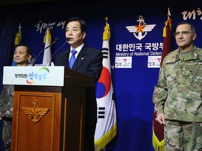 South Korean Defense Minister Han Min-koo, centre, speaks during a press conference as U.S. Forces Korea Commander Curtis Scaparrotti, right, listens at the Defense Ministry in Seoul, South Korea, on Jan. 7, 2016. In response to North Korea’s latest nuclear test, South Korea on Thursday announced it would resume cross-border propaganda broadcasts that Pyongyang considers an act of war. Seoul also began talks with Washington that could see the arrival of nuclear-powered U.S. aircraft and submarines to the Korean Peninsula. (Hwang Gwang-mo/Yonhap via AP)
