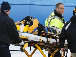 Boston Pride’s Denna Laing is wheeled off the ice after being injured during a game against the Montreal Les Canadiennes at Gillette Stadium in Foxborough, Mass., Thursday, Dec. 31, 2015. (AP Photo/Michael Dwyer)