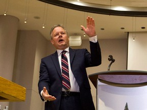Stephen S. Poloz, governor of the Bank of Canada, answers questions after delivering a speech at Ottawa City Hall Council Chambers, in Ottawa, on Thursday, Jan. 7, 2016. THE CANADIAN PRESS/Fred Chartrand