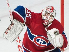 Montreal Canadiens goaltender Dustin Tokarski makes a save against the Ottawa Senators in Montreal Saturday, Dec. 12, 2015. (THE CANADIAN PRESS/Graham Hughes)