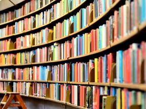 Books line the shelves of a library in this file photo. (Fotolia)