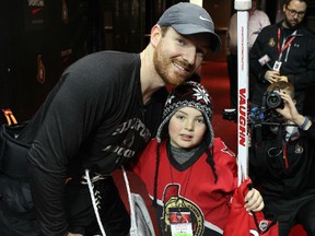 Blair Brewer, 10, meets his favourite Ottawa Senators player, goalie Andrew Hammond at Canadian Tire Centre on Thursday, Jan. 7, 2016. The club invited Blair and his family to the rink after reading about the Prescott fifth-grader in the Ottawa Sun. Blair struggles with learning disabilities and has seen his reading skills improve dramatically thanks to the Sens and the sports section. (Chris Hofley/Ottawa Sun)