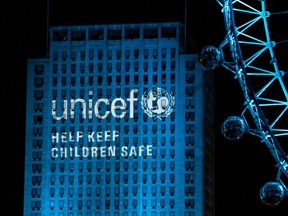 The London Eye and the Shell Building lit up in the Unicef's cyan blue. This is to encourage people to adopt keeping children safe as their New Years resolution.
WENN.com