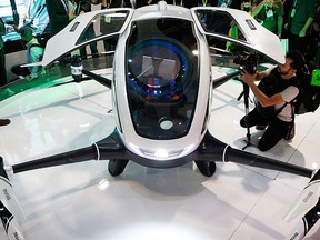 The Ehang 184 autonomous aerial vehicle is unveiled at the EHang booth at CES International, Wednesday, Jan. 6, 2016, in Las Vegas. The drone is large enough to fit a human passenger. (AP Photo/John Locher)