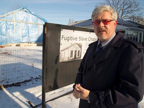 Joe O?Neill, standing in front of the Fugitive Slave Chapel that was moved from Thames Street to Grey Street, estimates he?s taken more than 1,000 photographs of the historic building, posting one picture every day to Facebook to document the chapel?s restoration. (MIKE HENSEN, The London Free Press)