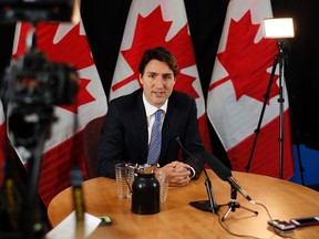 Prime Minister Justin Trudeau speaks with reporters during an interview with The Canadian Press in Ottawa on Wednesday, December 16, 2015. THE CANADIAN PRESS/ Patrick Doyle