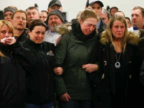 Chantal Mitchell (green jacket), who lost 7 horses in the Classy Lane Stables fire on Monday, is emotional during a tribute Thursday, Jan. 7 at Woodbine to the racehorses that died. (Stan Behal/Toronto Sun)
