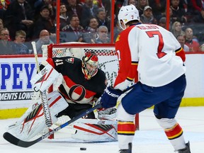 Ottawa Senators goalie Craig Anderson (41) stops Florida Panthers defenseman Dmitry Kulikov (7) during NHL action in Ottawa, Ont. on Thursday January 7, 2016. Errol McGihon/Ottawa Sun/Postmedia Network