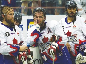 Dejected Rock players watch the Edmonton Rush be presented with the Champions Cup in last year’s NLL final. (David Bloom, Postmedia Network)