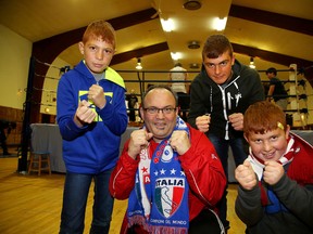 Gord Apolloni, head coach at Top Glove Boxing Academy, poses with Syrian refugees Osama, Mohamed and Nabil Qarqoz, in Sudbury, Ont. on Thursday January 7, 2016. Apolloni has given the boys who arrived last week a free membership to the academy. Gino Donato/Sudbury Star/Postmedia Network