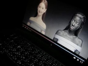 An online advertisement by Thai cosmetics company Seoul Secret showing Thai actress Cris Horwang, right, is displayed on a computer screen in Bangkok, Thailand, Friday, Jan. 8, 2016. The company has pulled a video in which the Thai movie star wears blackface and promotes a skin-whitener with the slogan: "You just need to be white to win." Seoul Secret issued a "heartfelt apology," saying in a statement it had had no intention to convey racist messages. (AP Photo/Charles Dharapak)