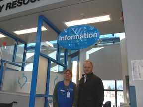 St. Thomas Elgin General Hospital volunteer Debbie Willert and STEGH Foundation executive director Paul Jenkins point out the hospital's brand new Patient and Family Resource Centre. The foundation spent $25,000 to build the information kiosk and lounge space in the hospital atrium.