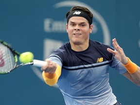 Milos Raonic of Canada plays a shot in his quarterfinal game against Lucas Pouille of France during the Brisbane International tournament in Brisbane, Australia, Friday, Jan. 8, 2016. (AP Photo/Tertius Pickard)