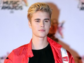 FILE - In this Nov. 7, 2015 file photo,  Justin Bieber arrives at the Cannes festival palace in Cannes, southeastern France. (AP Photo/Lionel Cironneau, File)