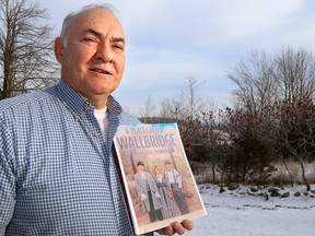 TIM MILLER/THE INTELLIGENCER
Alex McNaught, at his home in Wallbridge, holds up a mock-up potential front cover for his book detailing the history of Wallbridge. McNaught is currently asking for any historical photos, letters or other items people would like to see included in the final version of the book.