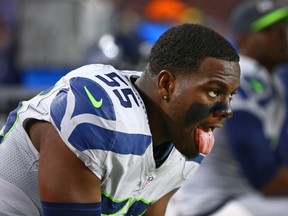 Seattle Seahawks defensive end Frank Clark sticks out his tongue as he reacts on the sidelines against the Arizona Cardinals at University of Phoenix Stadium in Glendale on Jan. 3, 2016. (Mark J. Rebilas/USA TODAY Sports)