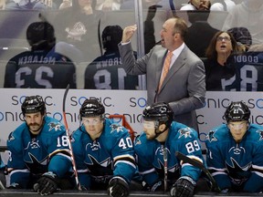 San Jose Sharks head coach Peter DeBoer instructs his team during the first period of an NHL pre-season game against the Anaheim Ducks in San Jose on Sept. 26, 2015. (AP Photo/Marcio Jose Sanchez)