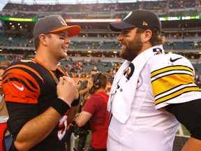 Steelers quarterback Ben Roethlisberger (right) talks with Bengals quarterback AJ McCarron (left) after the Steelers beat the Bengals 33-20 at Paul Brown Stadium in Cincinnati on Dec. 13, 2015. The Bengals host the Steelers on Saturday in an NFL wild card playoff game. (David Kohl/USA TODAY Sports)