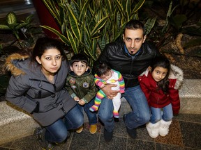 Mahmoud El Annan (second from right) poses for a photo with his family, including wife Maysaa (left), Abbas (second from left), 3, Kadinje, 4, and baby daughter Ezabella, in Edmonton, Alta., on Wednesday January 6, 2016. Mahmoud El Annan faces deportation from Canada by the end of the month, and is receiving help from his brother Wissam, who is from Fort McMurray. Ian Kucerak/Edmonton Sun