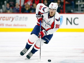 Washington Capitals forward Marcus Johansson skates with the puck against the Washington Capitals during the second period at PNC Arena in Raleigh, N.C., on Dec. 31, 2015. (James GuilloryéUSA TODAY Sports)