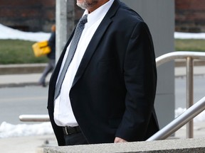 Dr. Rod Kunynetz leaves his disciplinary hearing at the College of Physicians and Surgeons of Ontario during lunch on Jan. 6, 2016. (Jack Boland/Toronto Sun)