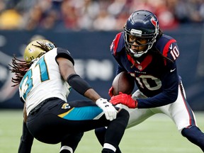Houston Texans wide receiver DeAndre Hopkins looks to get by Jacksonville Jaguars cornerback Davon House during the second half at NRG Stadium in Houston on Jan. 3, 2016. (Kevin Jairaj/USA TODAY Sports)