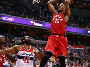 Toronto Raptors guard DeMar DeRozan goes up for a dunk in front of Washington Wizards centre Nene during a game in Washington on Jan. 8, 2016. (AP Photo/Alex Brandon)