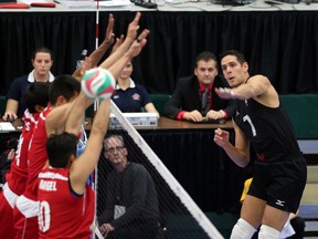 Canada's Dallas Soonias spikes the ball past Team Mexico during during NORCECA Men's Continental Olympic Qualification at the Saville Centre on Friday. (Perry Mah, Edmonton Sun)