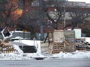 Wood pallets are piled in front of the Sudbury Jail on Friday. About 90 members of OPSEU Local 617  in Sudbury were preparing for a possible lockout or strike at 12:01 a.m. on Sunday. However, an agreement has been reached. John Lappa/Sudbury Star/Postmedia Network