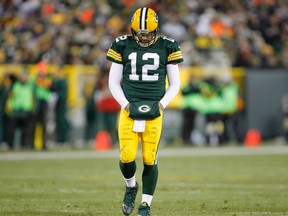 In this Sunday, Jan. 3, 2016, file photo, Green Bay Packers' Aaron Rodgers walks off the field during the second half an NFL football game against the Minnesota Vikings in Green Bay, Wis. (AP Photo/Matt Ludtke, File)