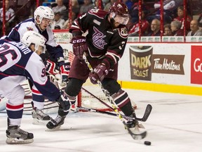 Defenceman Cameron Lizotte (3) of the Peterborough Petes moves the puck against the Windsor Spitfires on October 8, 2015 at the WFCU Centre in Windsor, Ontario, Canada.  Dennis Pajot/Getty Images/AFP