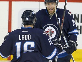 Andrew Ladd (left) and Blake Wheeler are ready to play former teammate Evander Kane on Sunday. (Brian Donogh/Winnipeg Sun file photo)