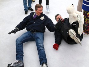 Toronto Mayor John Tory does a fake fall with city councillor Glenn De Baeremaeker  at the Mayor's New Year's Skating Party at Albert Campbell Square in Scarborough on Saturday January 9, 2016. Michael Peake/Toronto Sun/Postmedia Network