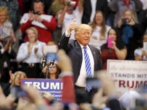 Republican presidential candidate Donald Trump gives a thumbs up as he is announced during a campaign event in Rock Hill, South Carolina January 8, 2016. REUTERS/Chris Keane