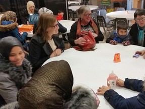 Folks gather around tables at a friendly meet and greet event for Syrian refugees at the Leefield Community Centre, 7910 - 36 Avenue, in Edmonton, AB. TREVOR ROBB/Edmonton Sun/ Postmedia Network