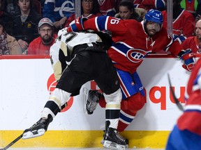 Pittsburgh Penguins forward Tom Kuhnhackl (34) checks Montreal Canadiens defenceman P.K. Subban (76) during the first period at the Bell Centre in Montreal on Saturday, January 9, 2016. The Pens defeated the Habs 3-1. (Eric Bolte/USA TODAY Sports)