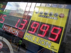 A light sign could not fit the record highest power ball payout at a local liquor store in Washington, January 10, 2016. The expected payout for the next drawing to a whopping $1.3 billion, played in 44 states, Washington and two U.S. territories. REUTERS/Yuri Gripas