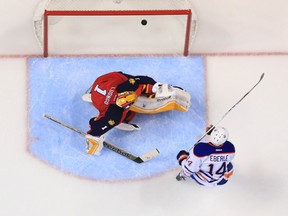 Jan 17, 2015; Sunrise, FL, USA; Edmonton Oilers right wing Jordan Eberle (14) scores a goal past Florida Panthers goalie Roberto Luongo (1) in the second period. The Oilers won 3-2 in a shootout at BB&T Center. Mandatory Credit: Robert Mayer-USA TODAY Sports